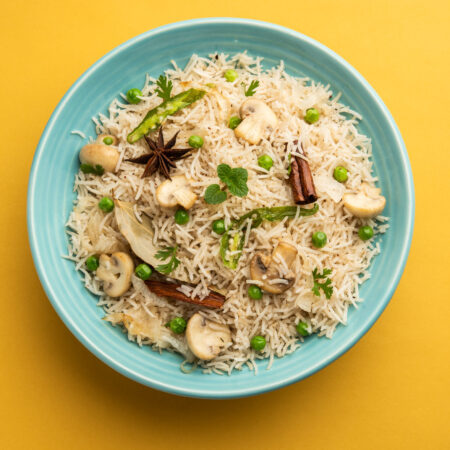 Tasty Mushroom or Mashroom Rice or Pulav or Pilaf or Pulao or Biryani served in a bowl or plate, selective focus